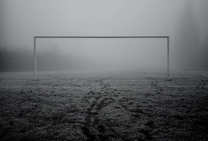 a soccer goal in the middle of a field